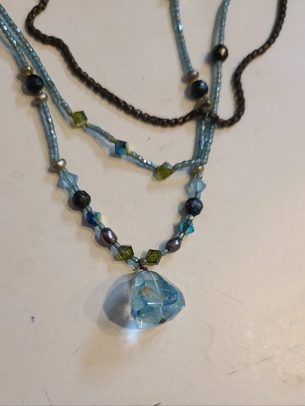 Beaded Multi-Strand Blue And Turquoise Pendant Necklace